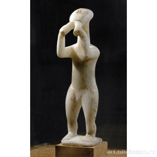 Музыкант, играющий на двойной флейте